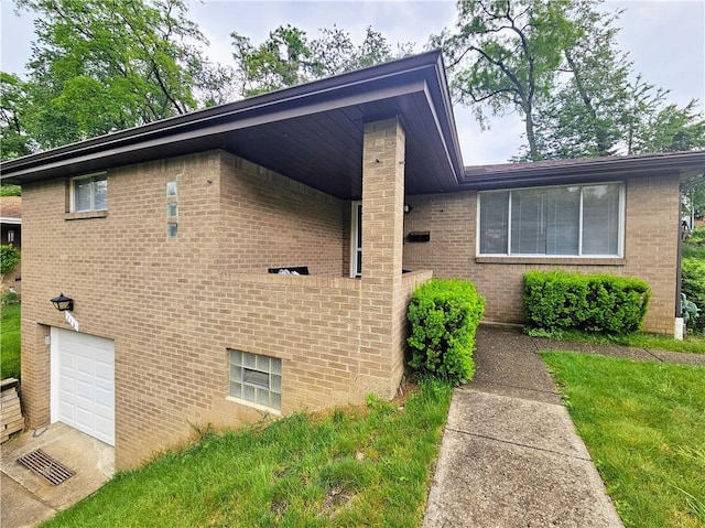 116 Bellwood Rd, West Mifflin, PA 15122 - view of side of property with a garage and brick siding