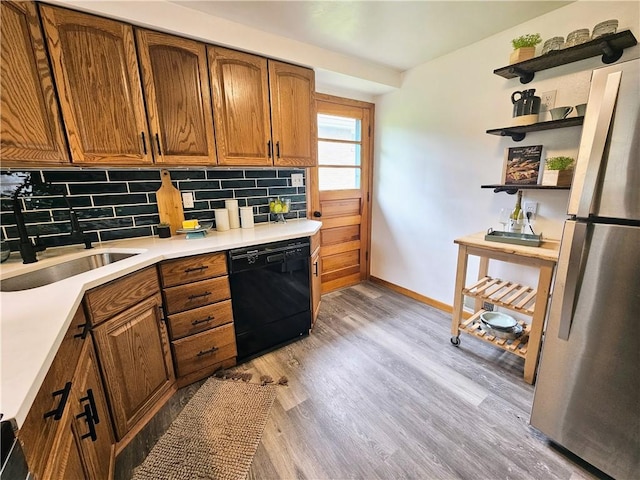 116 Bellwood Rd, West Mifflin, PA 15122 - kitchen featuring dishwasher, freestanding refrigerator, open shelves, a sink, and brown cabinetry