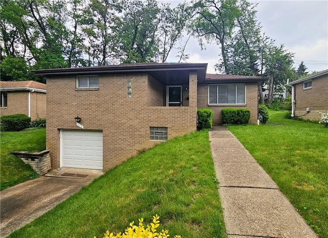 116 Bellwood Rd, West Mifflin, PA 15122 - tri-level home with a garage, a front lawn, brick siding, and driveway