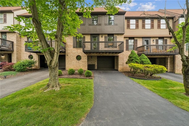 2708 Bingham Dr, Upper St Clair, PA 15241 - townhome / multi-family property with brick siding, an attached garage, and driveway