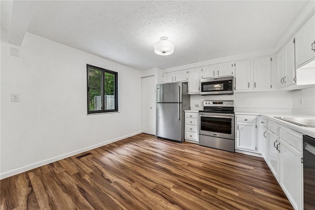 2708 Bingham Dr, Upper St Clair, PA 15241 - kitchen featuring stainless steel appliances, dark wood-style flooring, white cabinets, light countertops, and baseboards