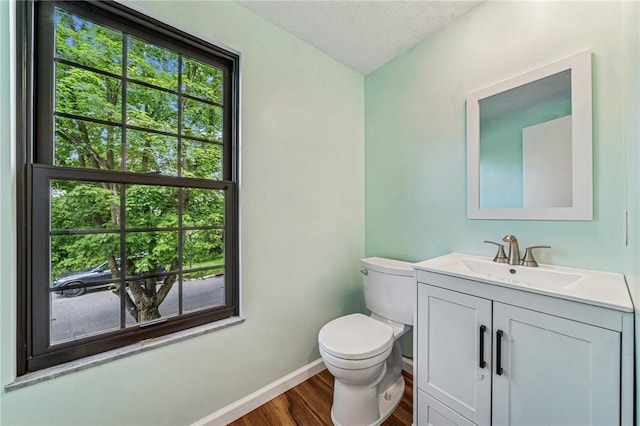 2708 Bingham Dr, Upper St Clair, PA 15241 - bathroom featuring toilet, wood finished floors, baseboards, vanity, and a textured ceiling