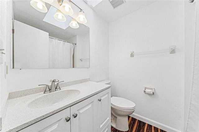 2708 Bingham Dr, Upper St Clair, PA 15241 - bathroom with wood finished floors, vanity, toilet, and baseboards
