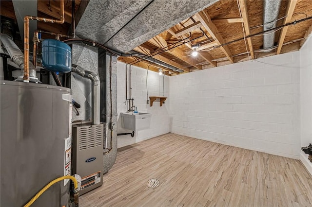2708 Bingham Dr, Upper St Clair, PA 15241 - unfinished below grade area with gas water heater, wood finished floors, a sink, and heating unit