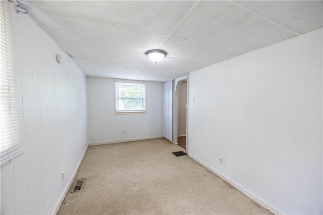 619 1st St, Verona, PA 15147 - carpeted empty room with arched walkways and baseboards