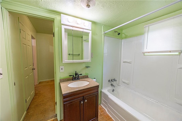 619 1st St, Verona, PA 15147 - full bath featuring vanity, a textured ceiling, and  shower combination