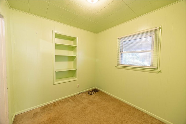 619 1st St, Verona, PA 15147 - unfurnished room with carpet floors, built in shelves, and baseboards