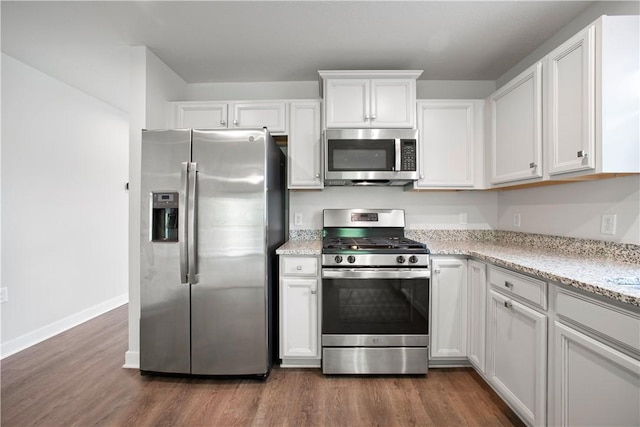 339 Nelson Dr, Monroeville, PA 15146 - kitchen featuring stainless steel appliances, dark wood-style flooring, white cabinetry, and baseboards