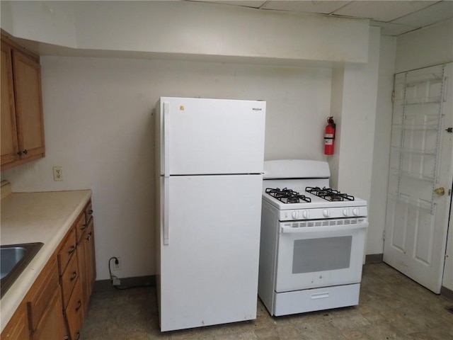 3921 Portman Ave, Observatory Hill, PA 15214 - kitchen featuring white appliances, brown cabinets, and light countertops