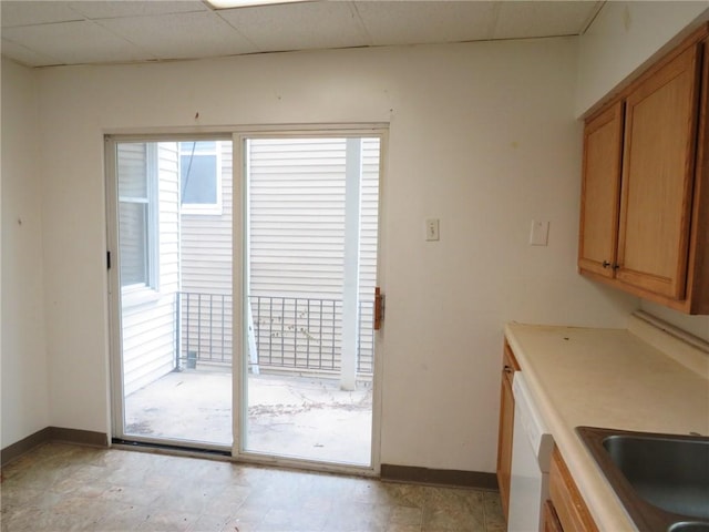 3921 Portman Ave, Observatory Hill, PA 15214 - kitchen featuring brown cabinetry, dishwasher, and light countertops