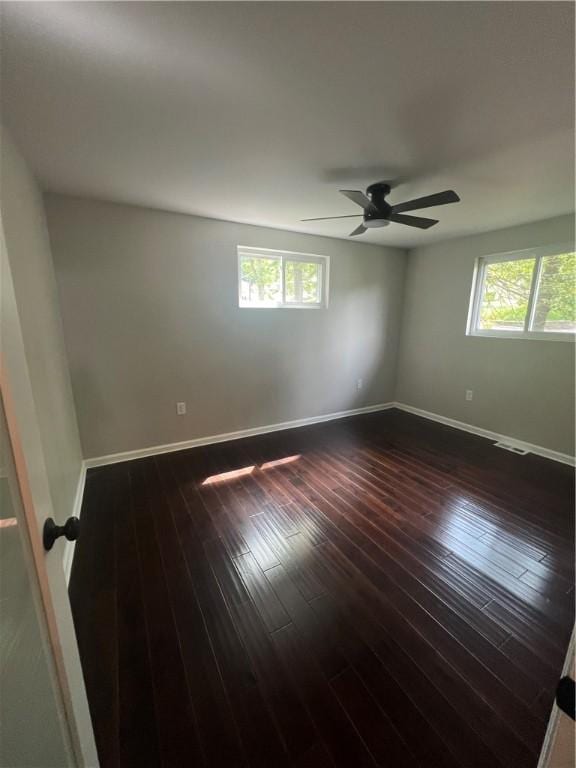 1601 Burchfield Rd, Shaler, PA 15101 - unfurnished room with healthy amount of natural light, ceiling fan, baseboards, and dark wood finished floors