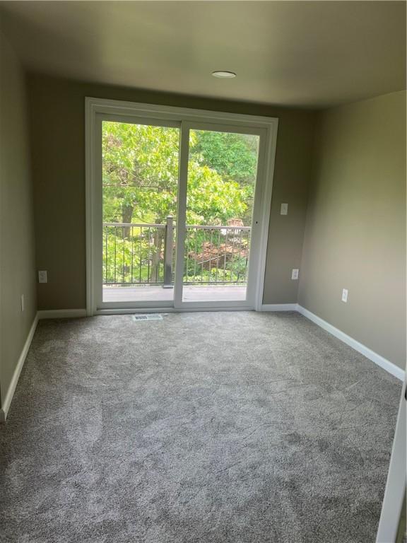 1601 Burchfield Rd, Shaler, PA 15101 - carpeted spare room with healthy amount of natural light and baseboards