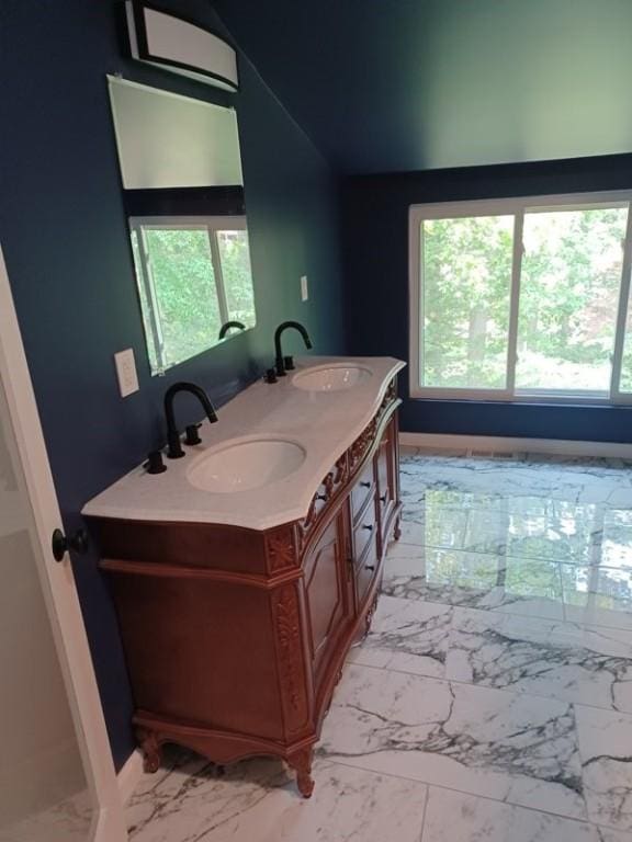 1601 Burchfield Rd, Shaler, PA 15101 - bathroom featuring marble finish flooring, double vanity, and lofted ceiling