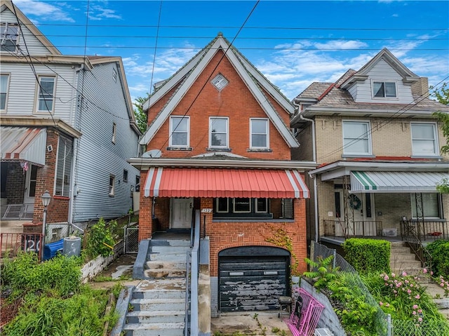 122 Margaret St, Mount Oliver, PA 15210 - view of front of house with brick siding, a porch, and stairs