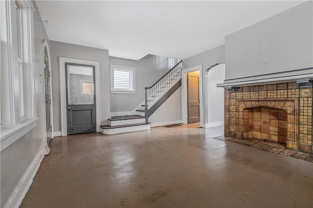 122 Margaret St, Mount Oliver, PA 15210 - unfurnished living room featuring baseboards, stairs, and concrete floors