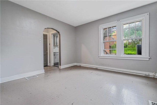 122 Margaret St, Mount Oliver, PA 15210 - empty room with arched walkways and baseboards