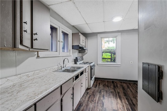 122 Margaret St, Mount Oliver, PA 15210 - kitchen featuring white gas range oven, a sink, a paneled ceiling, under cabinet range hood, and light countertops