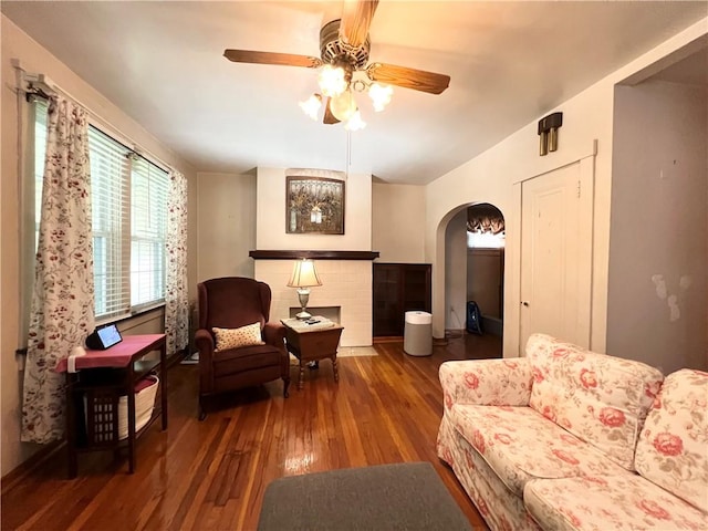 1673 Hancock Ave, Oklahoma Boro, PA 15613 - living area with arched walkways, a ceiling fan, and wood finished floors