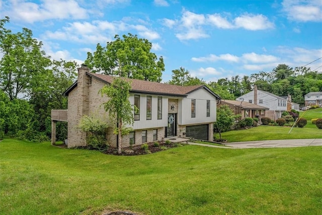 1382 Great Oak Dr, Scott Twp Sal, PA 15220 - raised ranch featuring a garage, a chimney, driveway, a front lawn, and brick siding