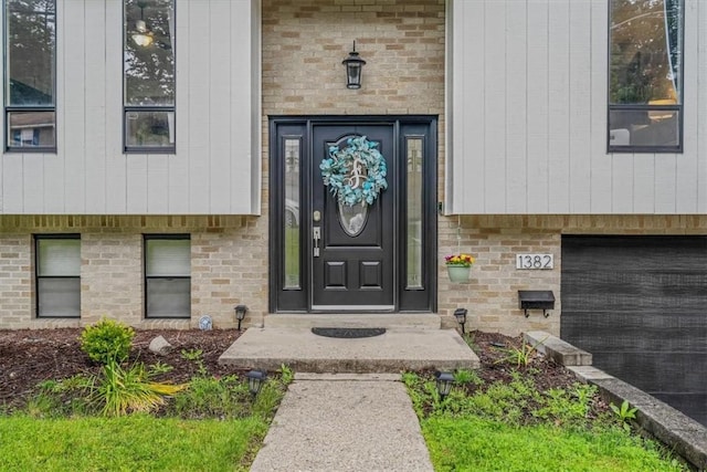 1382 Great Oak Dr, Scott Twp Sal, PA 15220 - view of exterior entry featuring brick siding and a garage