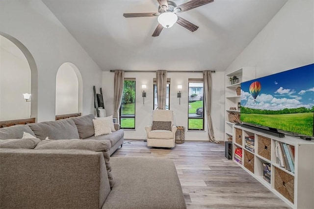 1382 Great Oak Dr, Scott Twp Sal, PA 15220 - living area featuring arched walkways, vaulted ceiling, wood finished floors, and a ceiling fan