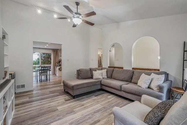 1382 Great Oak Dr, Scott Twp Sal, PA 15220 - living room with ceiling fan, light wood finished floors, arched walkways, and rail lighting