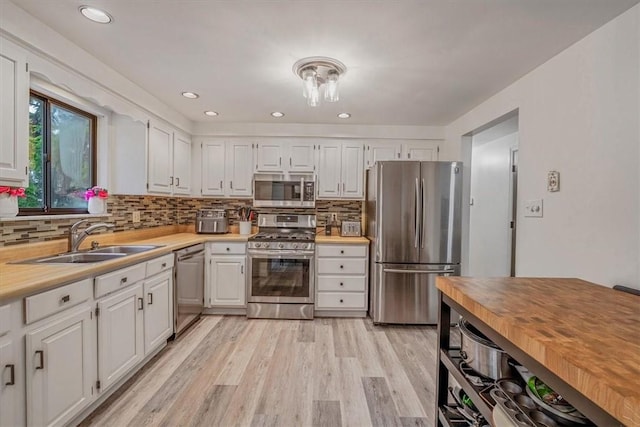 1382 Great Oak Dr, Scott Twp Sal, PA 15220 - kitchen with stainless steel appliances, a sink, white cabinetry, light wood finished floors, and recessed lighting