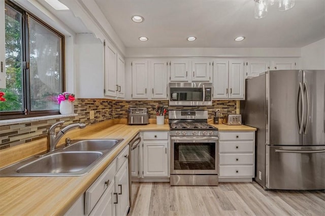 1382 Great Oak Dr, Scott Twp Sal, PA 15220 - kitchen with appliances with stainless steel finishes, a sink, white cabinetry, light countertops, and recessed lighting