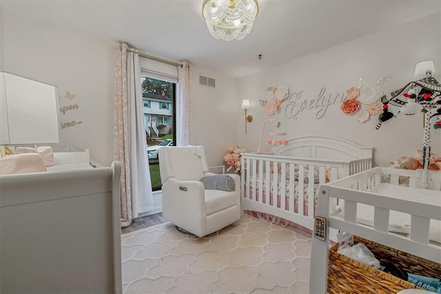 1382 Great Oak Dr, Scott Twp Sal, PA 15220 - bedroom featuring a crib, a chandelier, and baseboards
