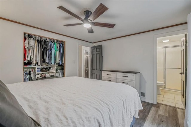 1382 Great Oak Dr, Scott Twp Sal, PA 15220 - bedroom with wood finished floors, ensuite bath, crown molding, a ceiling fan, and a closet