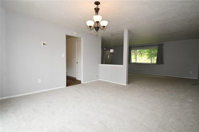 341 Macassar Dr, Baldwin Boro, PA 15236 - unfurnished living room featuring a chandelier, carpet flooring, and baseboards