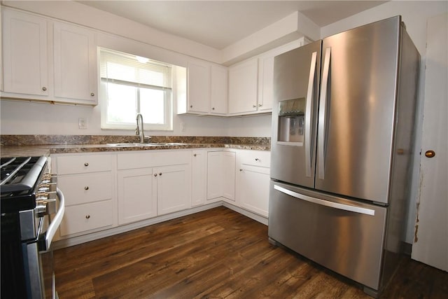 341 Macassar Dr, Baldwin Boro, PA 15236 - kitchen featuring appliances with stainless steel finishes, a sink, white cabinetry, dark wood finished floors, and dark stone counters