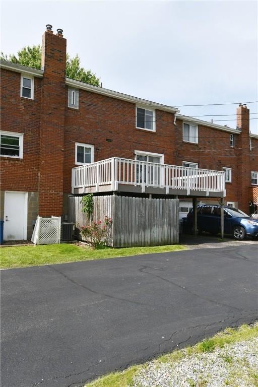 341 Macassar Dr, Baldwin Boro, PA 15236 - view of front facade with a chimney, central AC unit, and brick siding