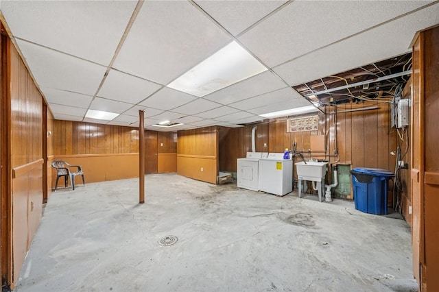 1124 Ridgeland Dr, Marshall Shadeland, PA 15212 - unfinished below grade area with washer and dryer, a sink, wooden walls, and a paneled ceiling