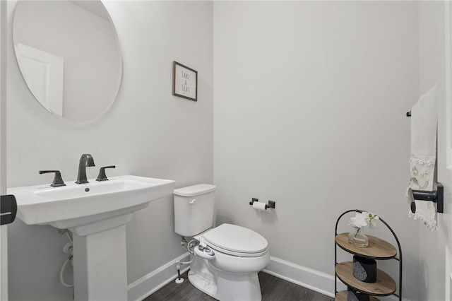 5023 Kensington Dr, Cecil, PA 15317 - bathroom with baseboards, wood finished floors, and toilet