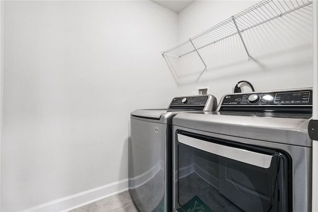 5023 Kensington Dr, Cecil, PA 15317 - washroom featuring washer and dryer and baseboards