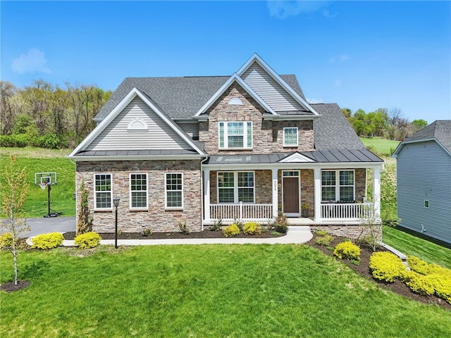 5023 Kensington Dr, Cecil, PA 15317 - craftsman inspired home featuring a standing seam roof, a porch, a front lawn, and stone siding
