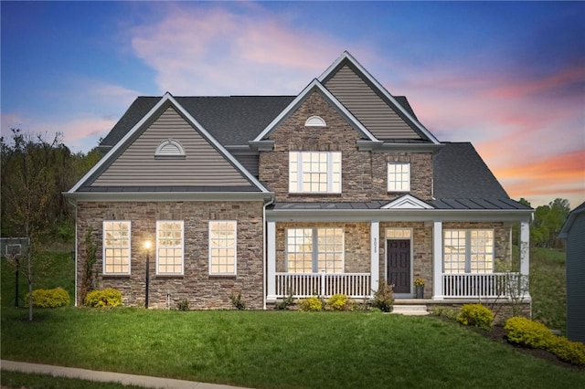 5023 Kensington Dr, Cecil, PA 15317 - view of front of property with a standing seam roof, covered porch, and a front lawn