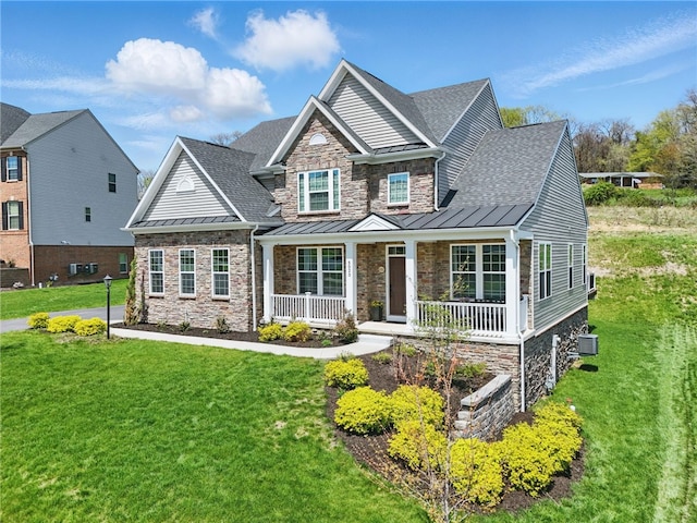 5023 Kensington Dr, Cecil, PA 15317 - craftsman house with a standing seam roof, stone siding, a porch, roof with shingles, and a front yard