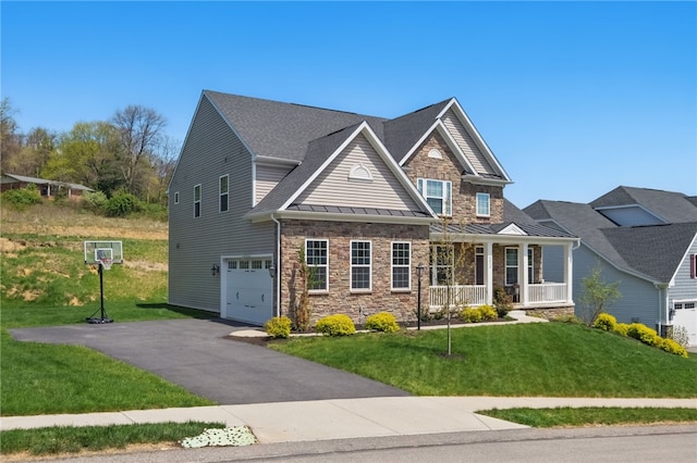 5023 Kensington Dr, Cecil, PA 15317 - craftsman house featuring an attached garage, a standing seam roof, a porch, a front lawn, and driveway