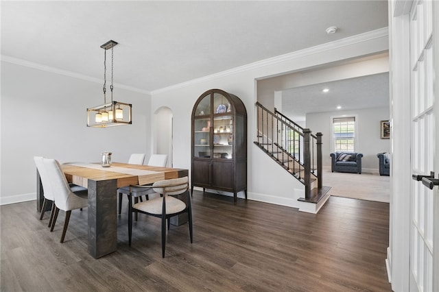 5023 Kensington Dr, Cecil, PA 15317 - dining room featuring baseboards, dark wood-style floors, stairs, arched walkways, and crown molding