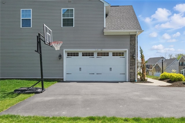 5023 Kensington Dr, Cecil, PA 15317 - view of property exterior featuring driveway, a shingled roof, and a garage