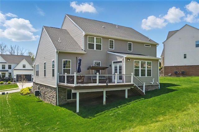 5023 Kensington Dr, Cecil, PA 15317 - back of property featuring a wooden deck, central AC, a lawn, and roof with shingles