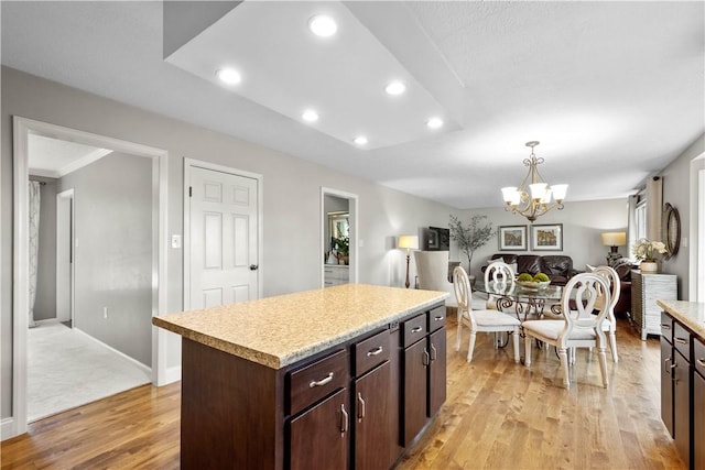 401 Pebble Creek Dr, Cranberry Twp, PA 16066 - kitchen featuring a chandelier, light countertops, light wood finished floors, recessed lighting, and dark brown cabinetry
