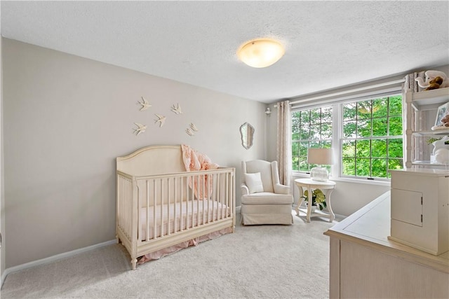 401 Pebble Creek Dr, Cranberry Twp, PA 16066 - bedroom with light colored carpet, a textured ceiling, a nursery area, and baseboards
