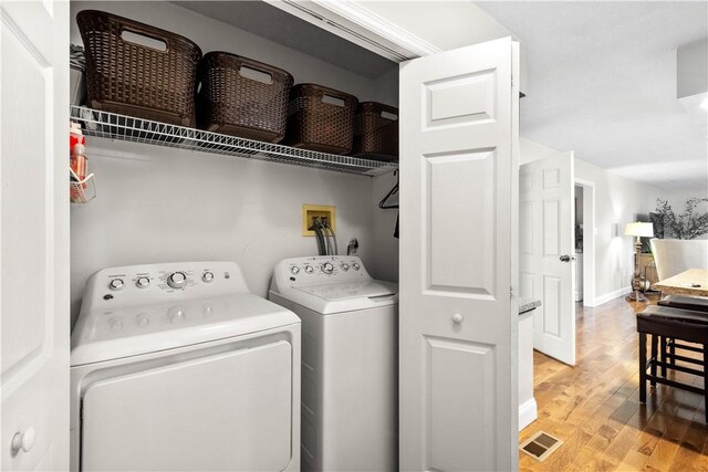 401 Pebble Creek Dr, Cranberry Twp, PA 16066 - laundry room with light wood-style floors, washer and clothes dryer, and baseboards