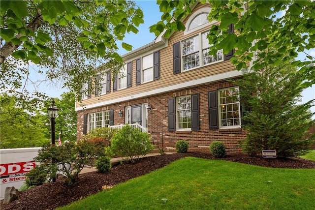 401 Pebble Creek Dr, Cranberry Twp, PA 16066 - view of front facade with a front yard and brick siding