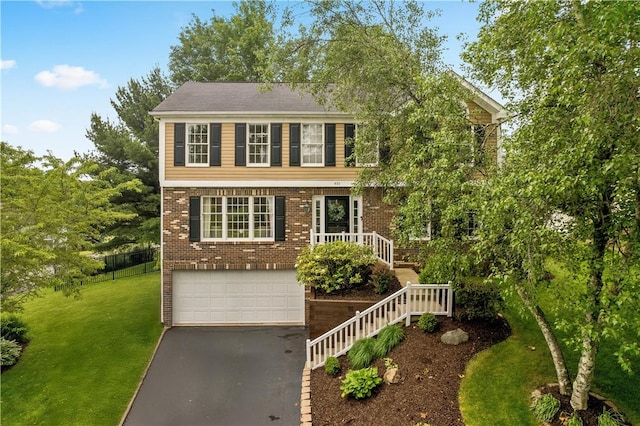 401 Pebble Creek Dr, Cranberry Twp, PA 16066 - colonial house with driveway, a garage, and brick siding