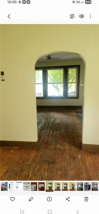 2722 Bethesda St, Carrick, PA 15227 - hall with arched walkways, dark wood finished floors, and baseboards