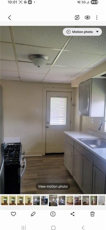 2722 Bethesda St, Carrick, PA 15227 - kitchen featuring a sink, a paneled ceiling, range, and dark wood finished floors